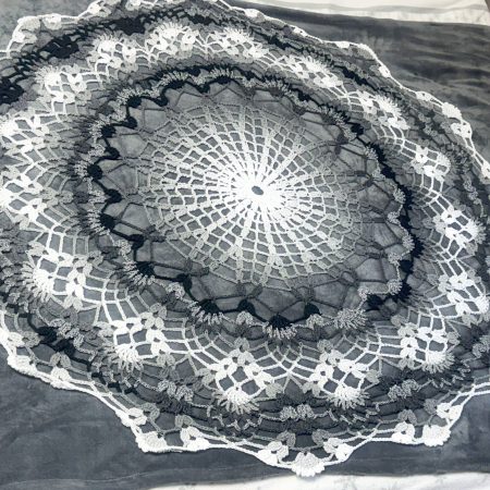 Crocheted round rug or bed cover
