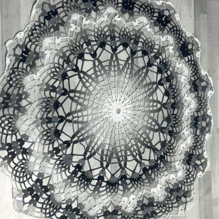 Crocheted round rug or bed cover