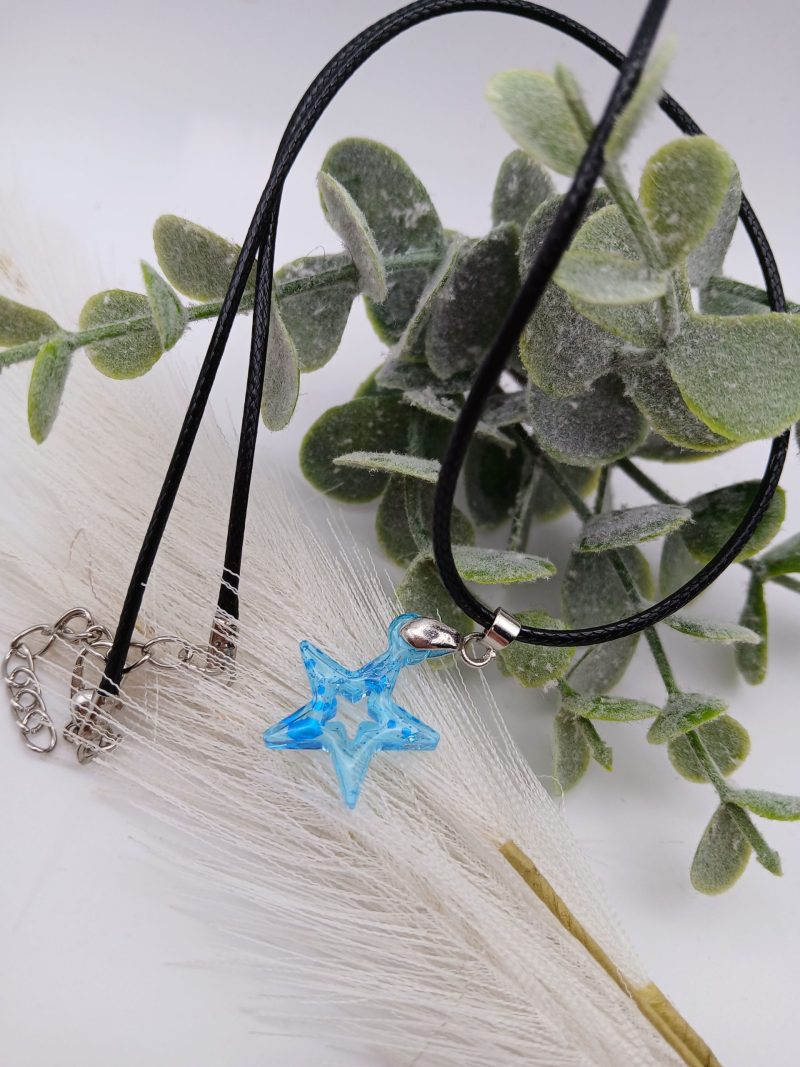 Blue Glitter Star Resin pendant on black cord