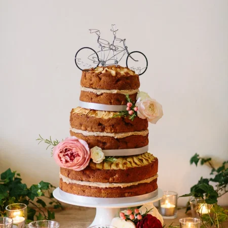 Tandem bicycle wedding cake topper.