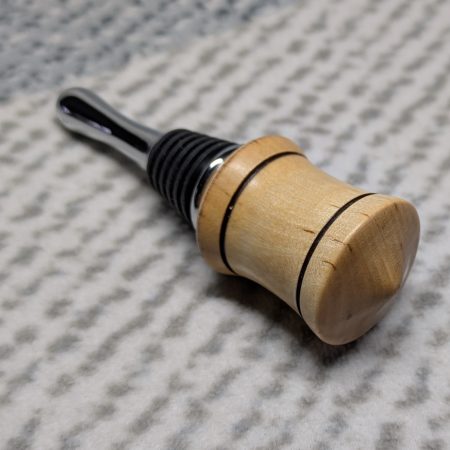 Hand turned bottle stopper made from birch with a chrome teardrop base
