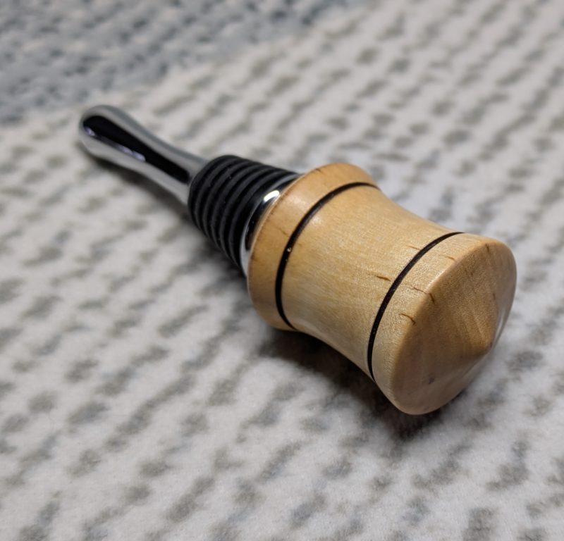 Hand turned bottle stopper made from birch with a chrome teardrop base