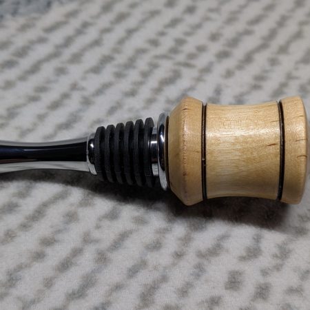 Hand turned bottle stopper made from birch with a chrome teardrop base