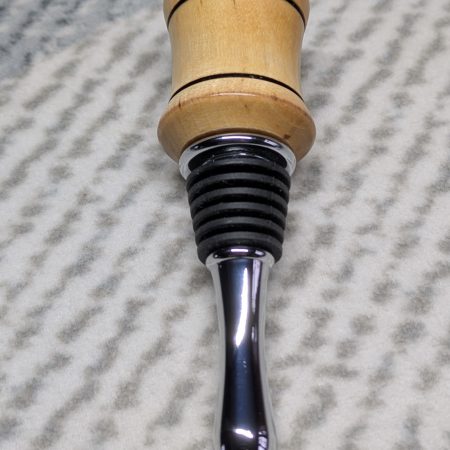 Hand turned bottle stopper made from birch with a chrome teardrop base