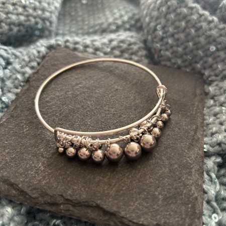 Silver plated and stainless steel drop ball bangle