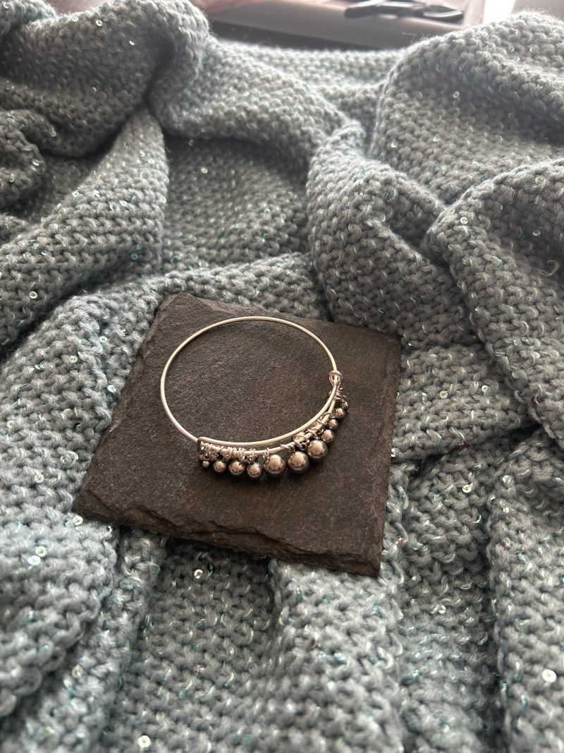 Silver plated and stainless steel drop ball bangle