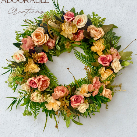 SOLD - A unique, vintage-style wreath with soft pastel flowers and green foliage, 40cm diameter.