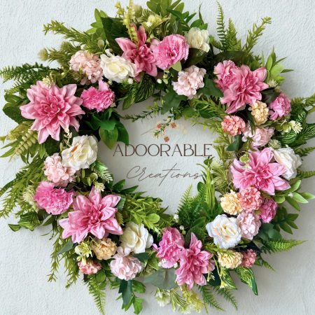 Handmade wreath in soft pinks with green leaves, perfect for summer decoration. Size 55cm