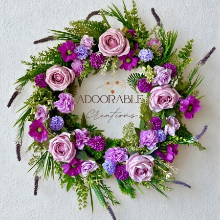 60cm Wreath with artificial flowers in subtle purple shades with green foliage