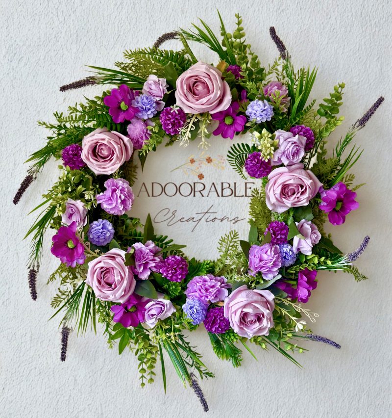 60cm Wreath with artificial flowers in subtle purple shades with green foliage