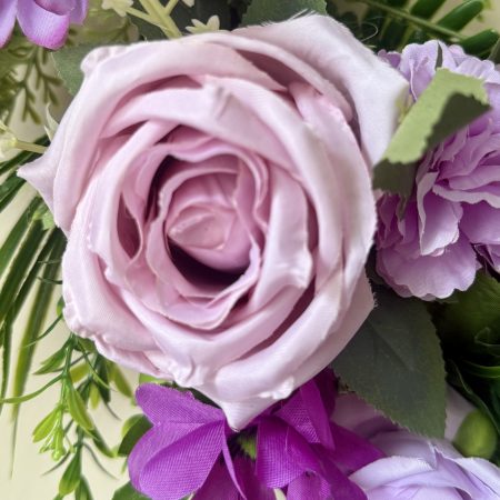 60cm Wreath with artificial flowers in subtle purple shades with green foliage