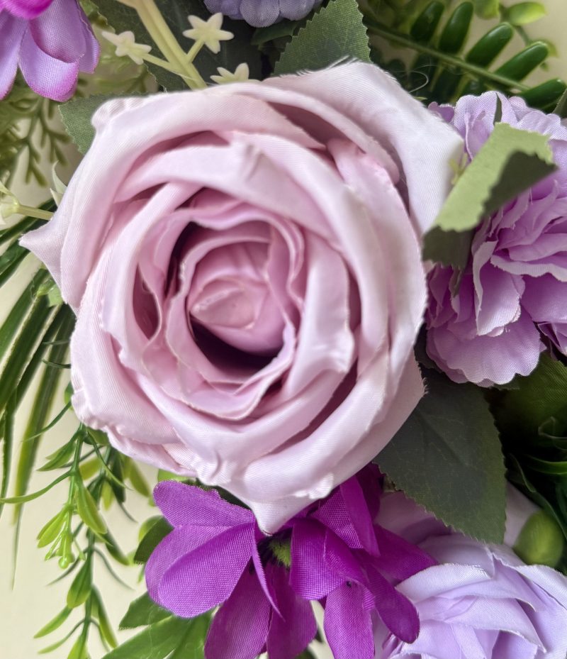 60cm Wreath with artificial flowers in subtle purple shades with green foliage