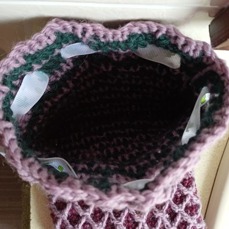 Crocheted wool drawstring bag.