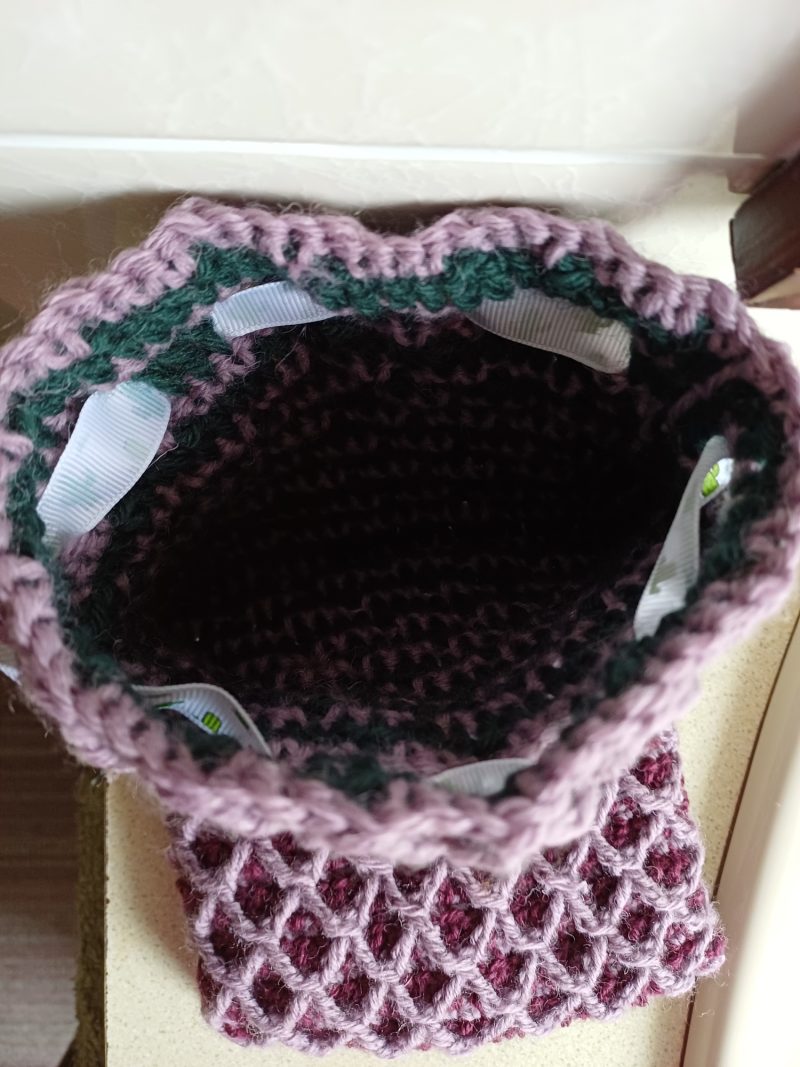 Crocheted wool drawstring bag.