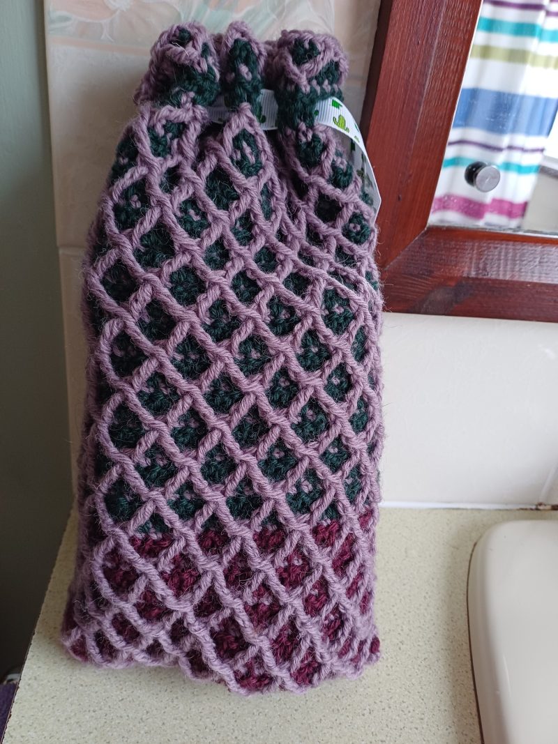 Crocheted wool drawstring bag.