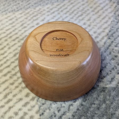 Hand turned bowl made from cherry wood with a gloss finish