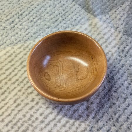 Hand turned bowl made from cherry wood with a gloss finish