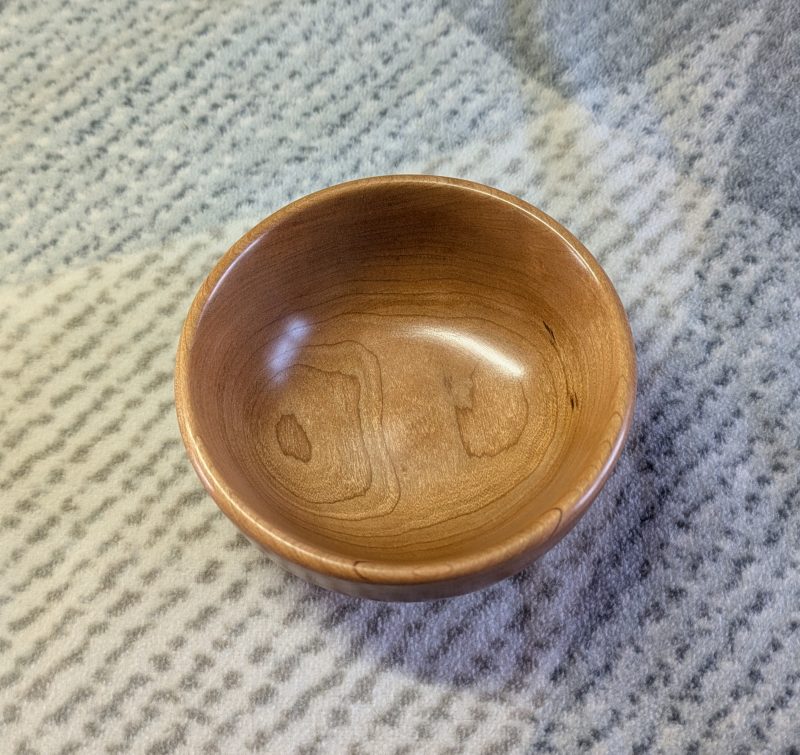 Hand turned bowl made from cherry wood with a gloss finish
