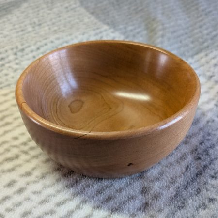 Hand turned bowl made from cherry wood with a gloss finish