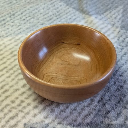 Hand turned bowl made from cherry wood with a gloss finish