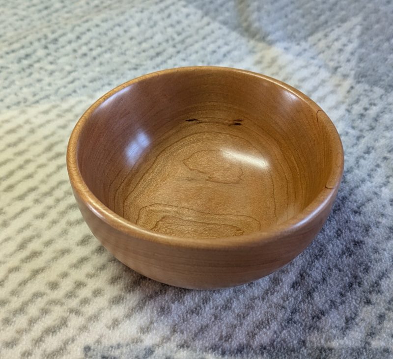 Hand turned bowl made from cherry wood with a gloss finish