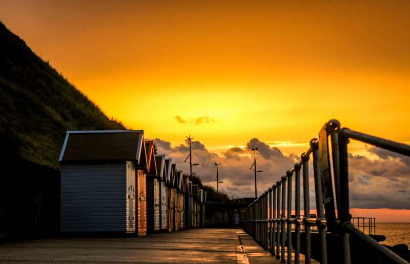 Beach Hut Sunset - Photographic Mounted Image.