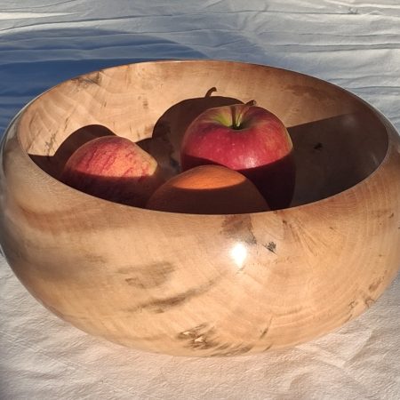 Decoratively shaped round bowl in natural spalted white poplar wood.