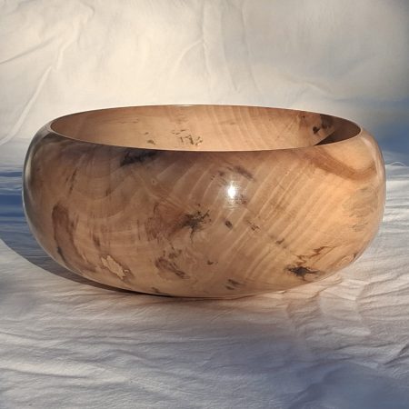 Decoratively shaped round bowl in natural spalted white poplar wood.