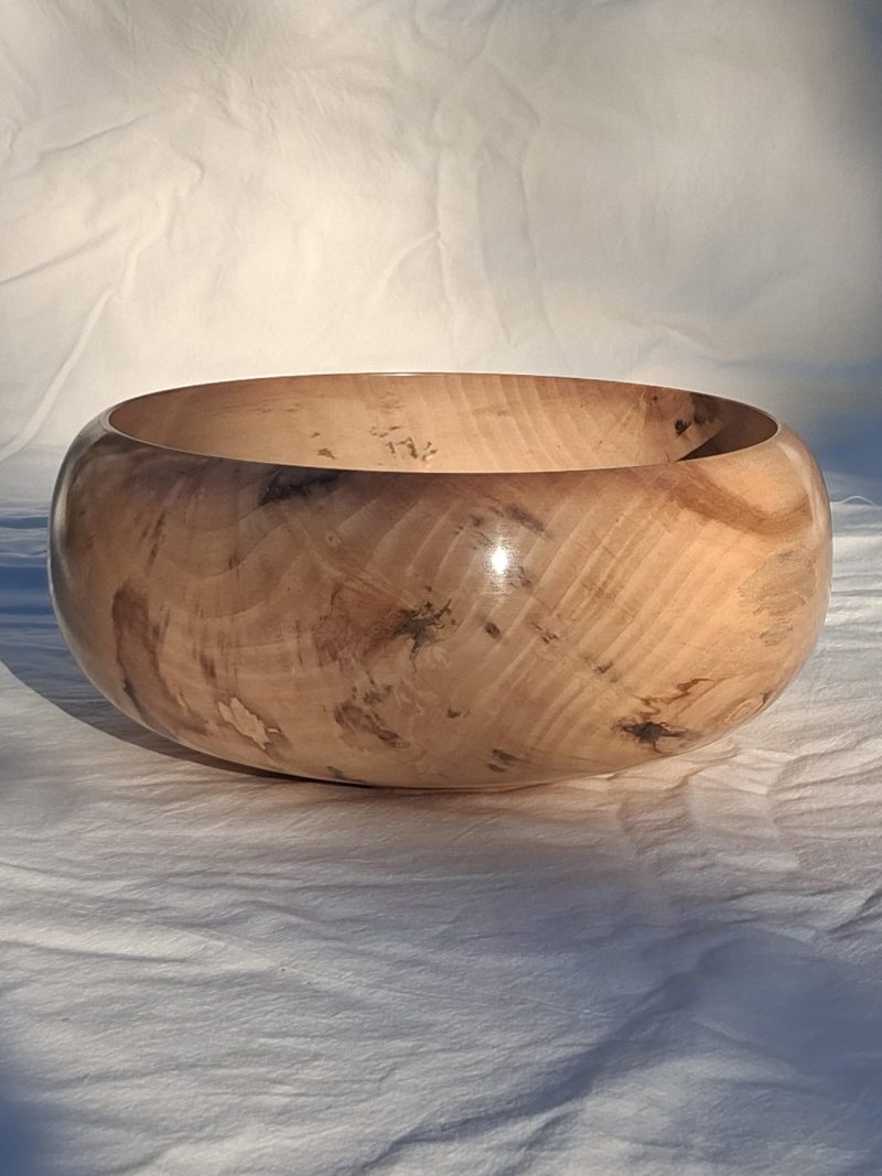 Decoratively shaped round bowl in natural spalted white poplar wood.