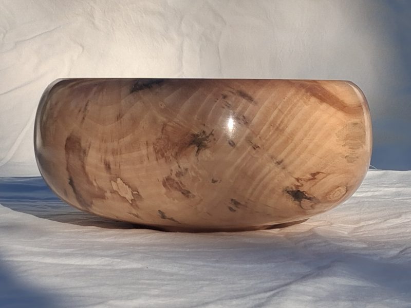 Decoratively shaped round bowl in natural spalted white poplar wood.