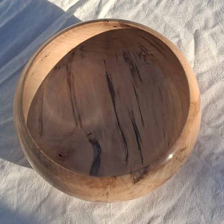 Decoratively shaped round bowl in natural spalted white poplar wood.