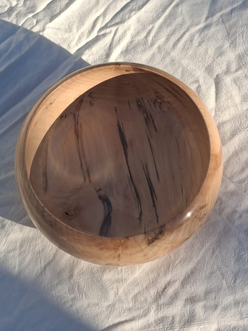 Decoratively shaped round bowl in natural spalted white poplar wood.