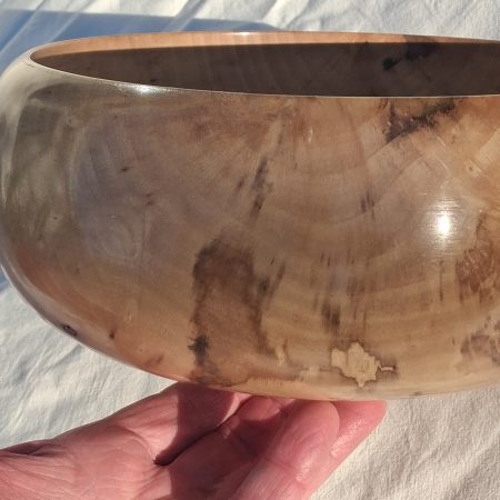Decoratively shaped round bowl in natural spalted white poplar wood.