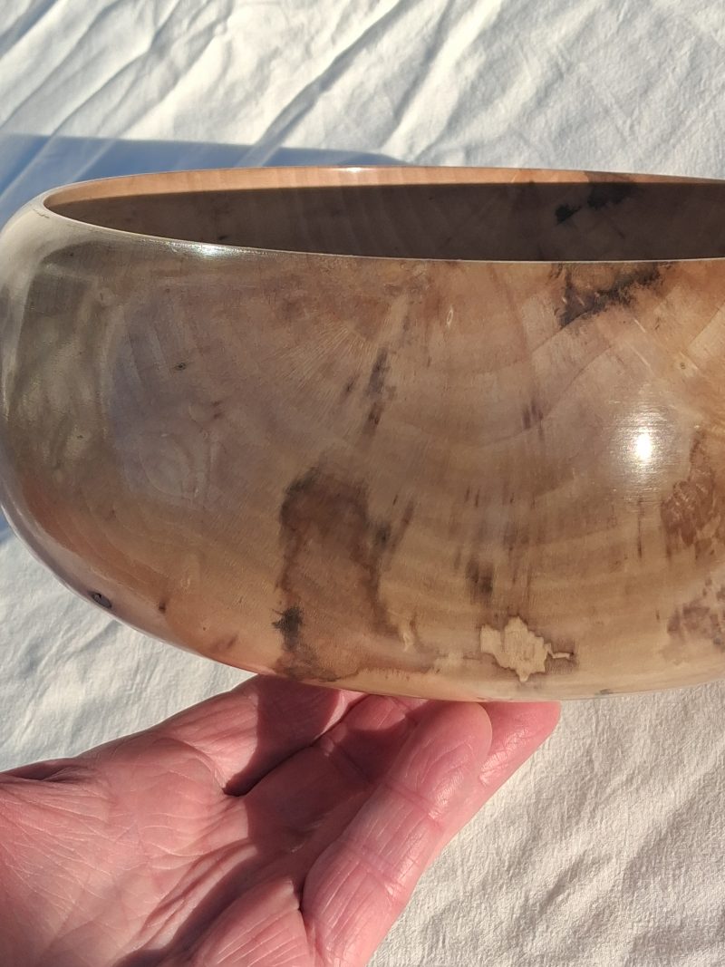 Decoratively shaped round bowl in natural spalted white poplar wood.