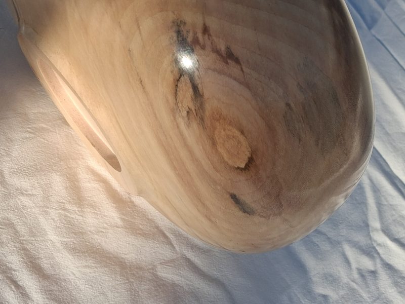 Decoratively shaped round bowl in natural spalted white poplar wood.