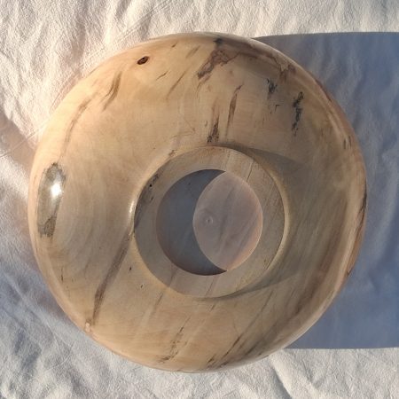 Decoratively shaped round bowl in natural spalted white poplar wood.