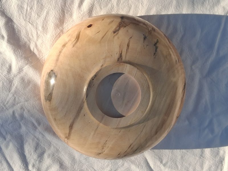 Decoratively shaped round bowl in natural spalted white poplar wood.