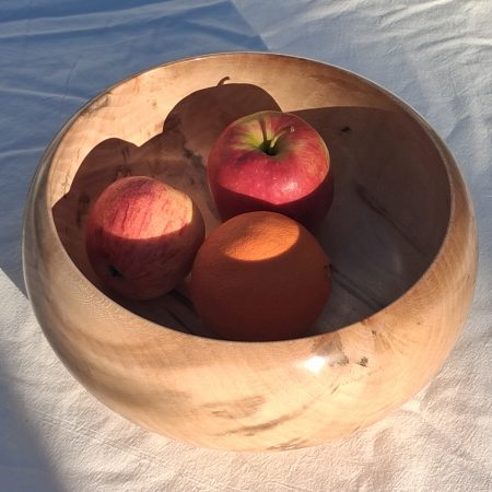 Decoratively shaped round bowl in natural spalted white poplar wood.