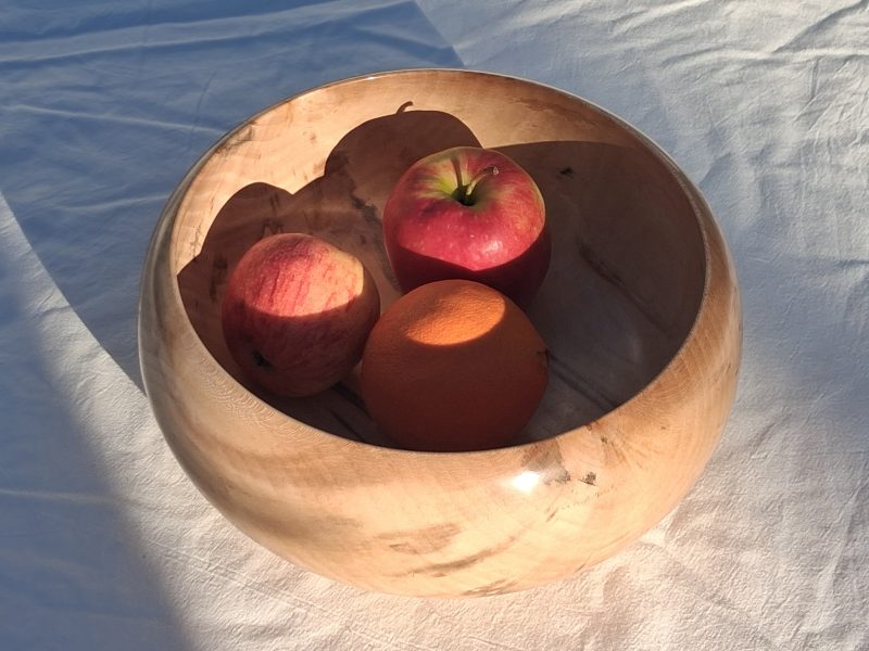 Decoratively shaped round bowl in natural spalted white poplar wood.