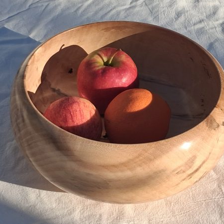 Decoratively shaped round bowl in natural spalted white poplar wood.