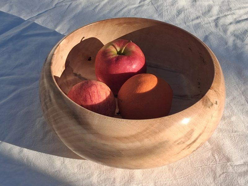 Decoratively shaped round bowl in natural spalted white poplar wood.
