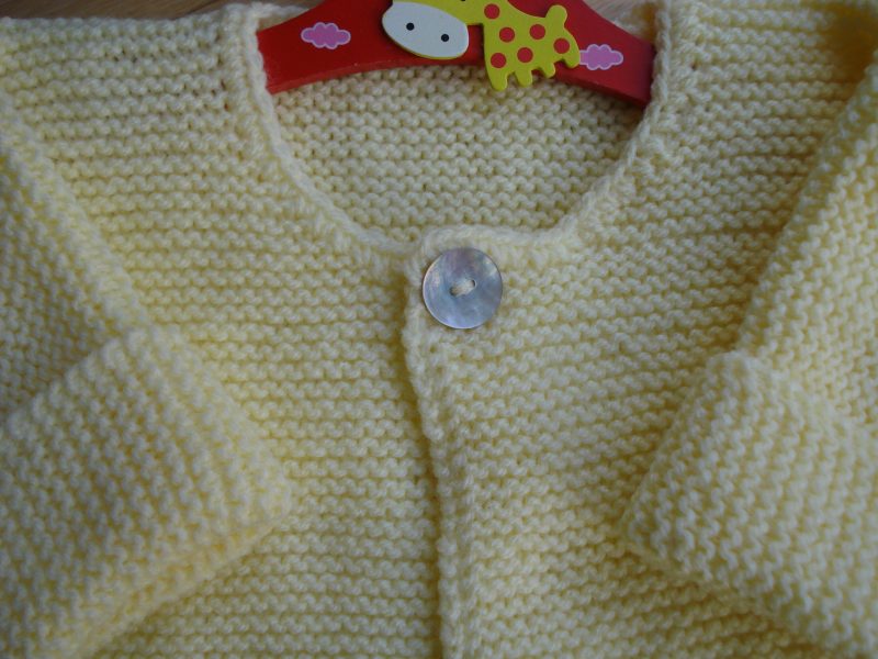 Pretty Hand Knitted Lemon Yellow Cardigan With One Pearl Button