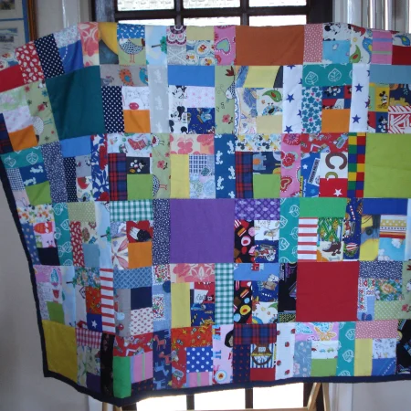 Handmade Quilt / Play Mat Multi Colours And Prints With A Navy Blue Backing