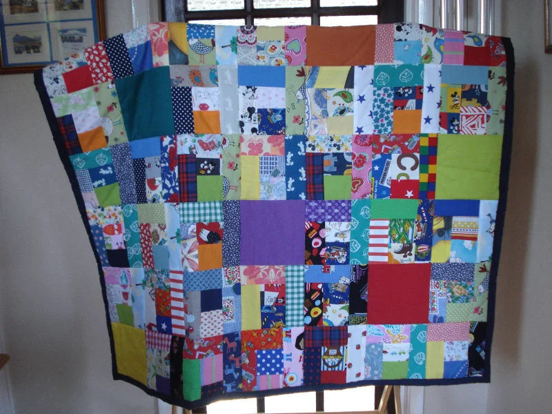 Handmade Quilt / Play Mat Multi Colours And Prints With A Navy Blue Backing