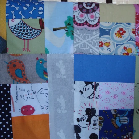 Handmade Quilt / Play Mat Multi Colours And Prints With A Navy Blue Backing