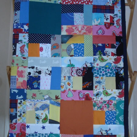 Handmade Quilt / Play Mat Multi Colours And Prints With A Navy Blue Backing