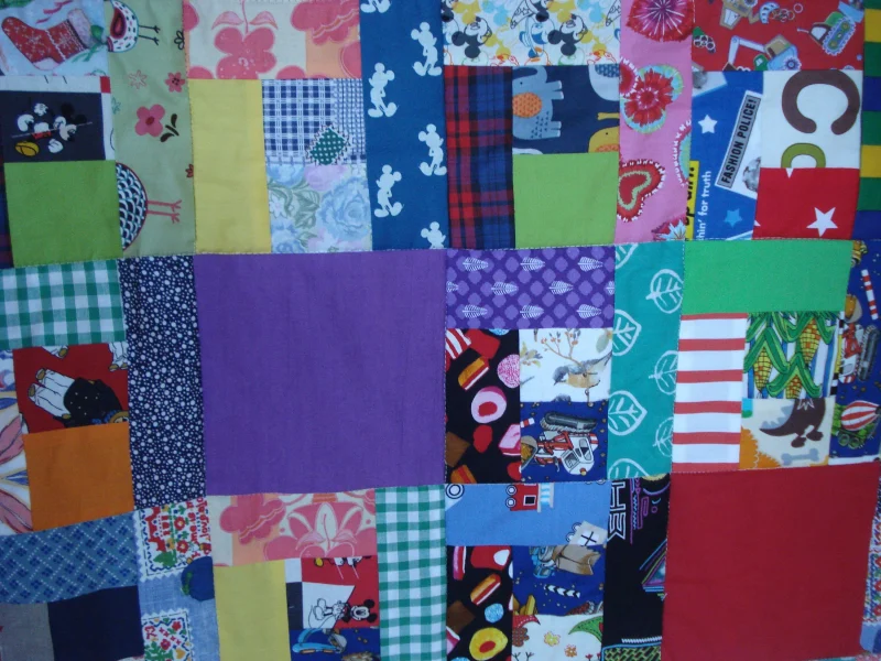Handmade Quilt / Play Mat Multi Colours And Prints With A Navy Blue Backing