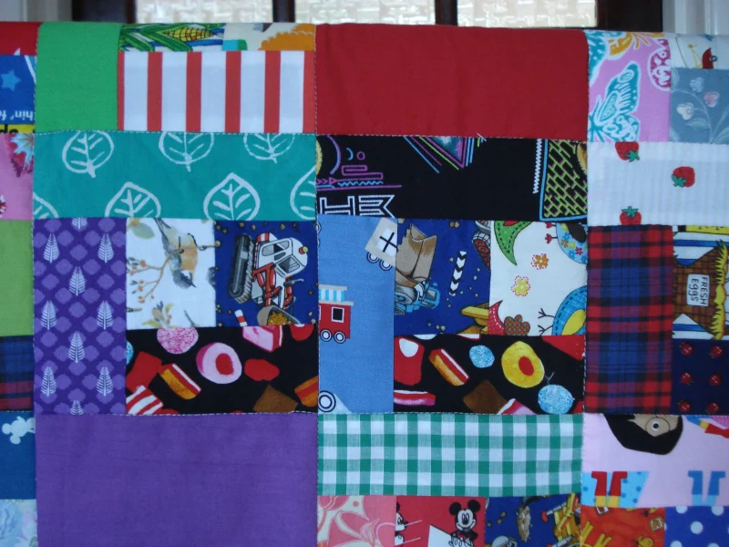 Handmade Quilt / Play Mat Multi Colours And Prints With A Navy Blue Backing