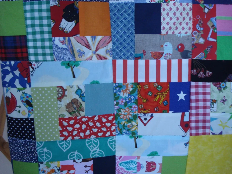 Handmade Quilt / Play Mat Multi Colours And Prints With A Navy Blue Backing