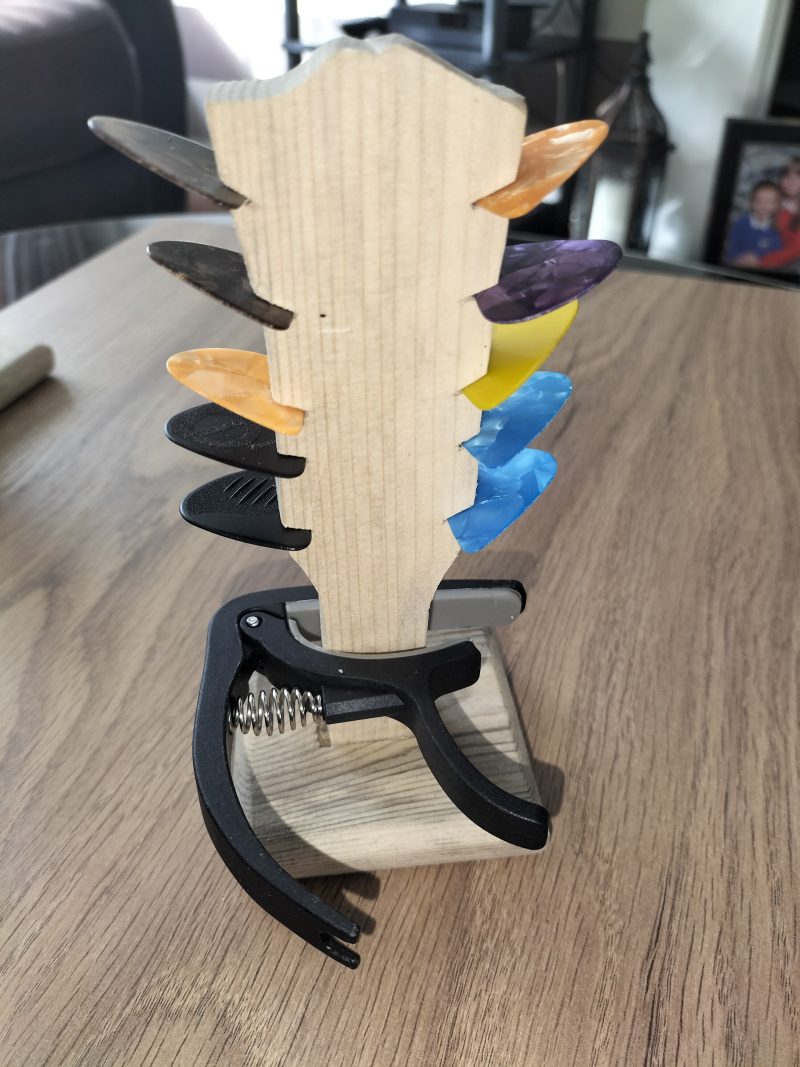 Guitar head stock pick holder
